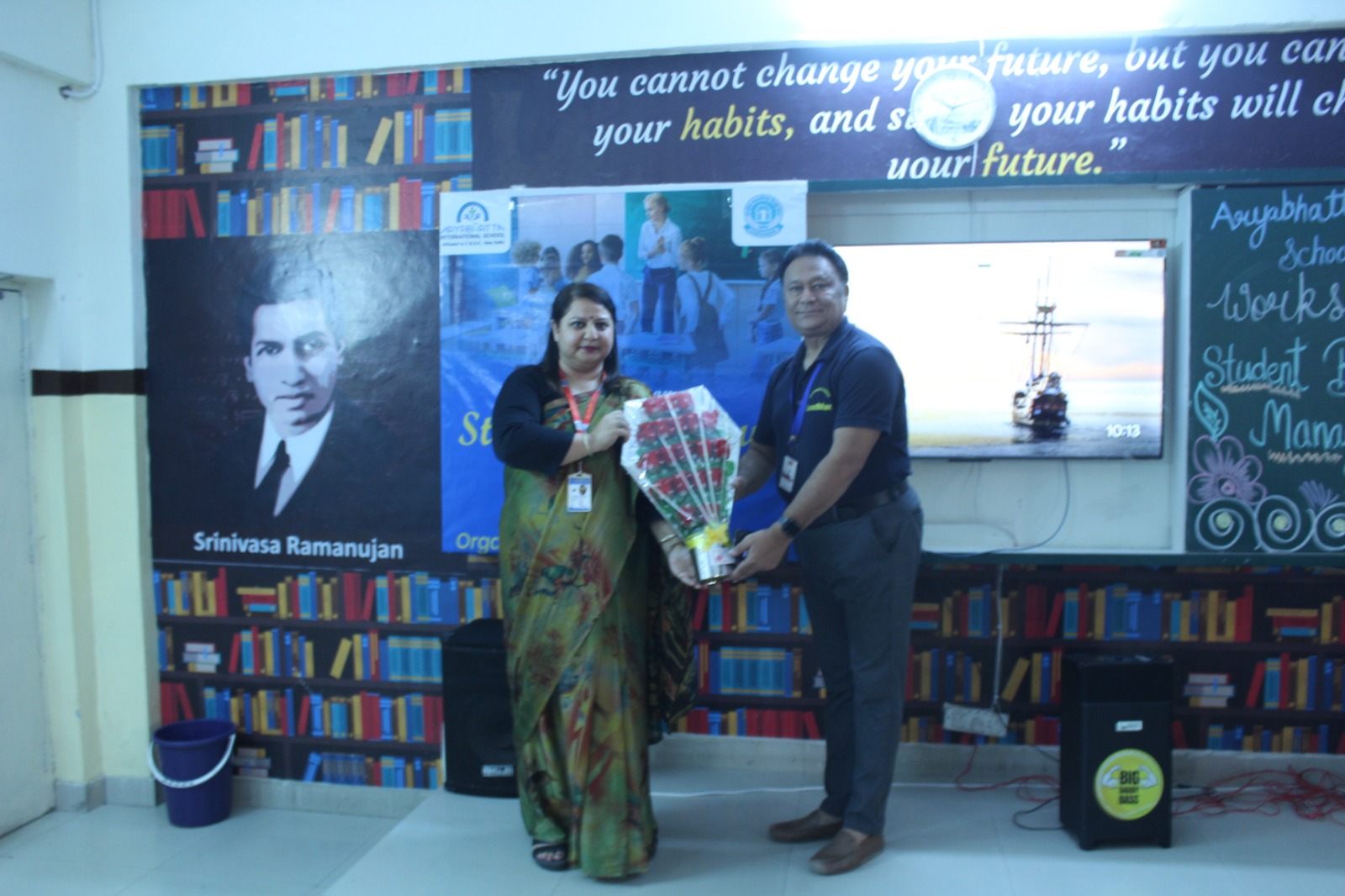 LeadmaxEdge facilitator receiving flowers during a school workshop event
