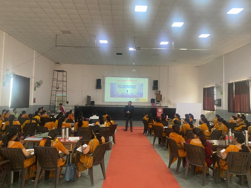 Self-investment workshop for educators in an auditorium